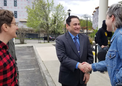 Joe Ruggiero shaking hands with Dutchess County Residents